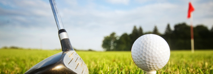 Close-up of a golf club and ball on a tee, showing how Medway chiropractic care can improve your swing.