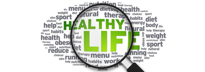 Magnifying glass highlighting healthy life words, representing guidance from a Medway chiropractor on improving your overall health and wellness.