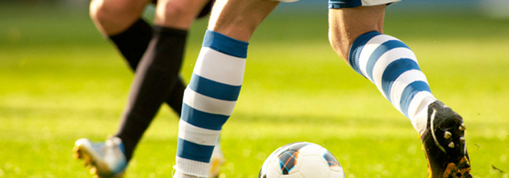 Athletes competing on a soccer field, demonstrating how localized chiropractic care improves performance and mobility for Medway sports players.